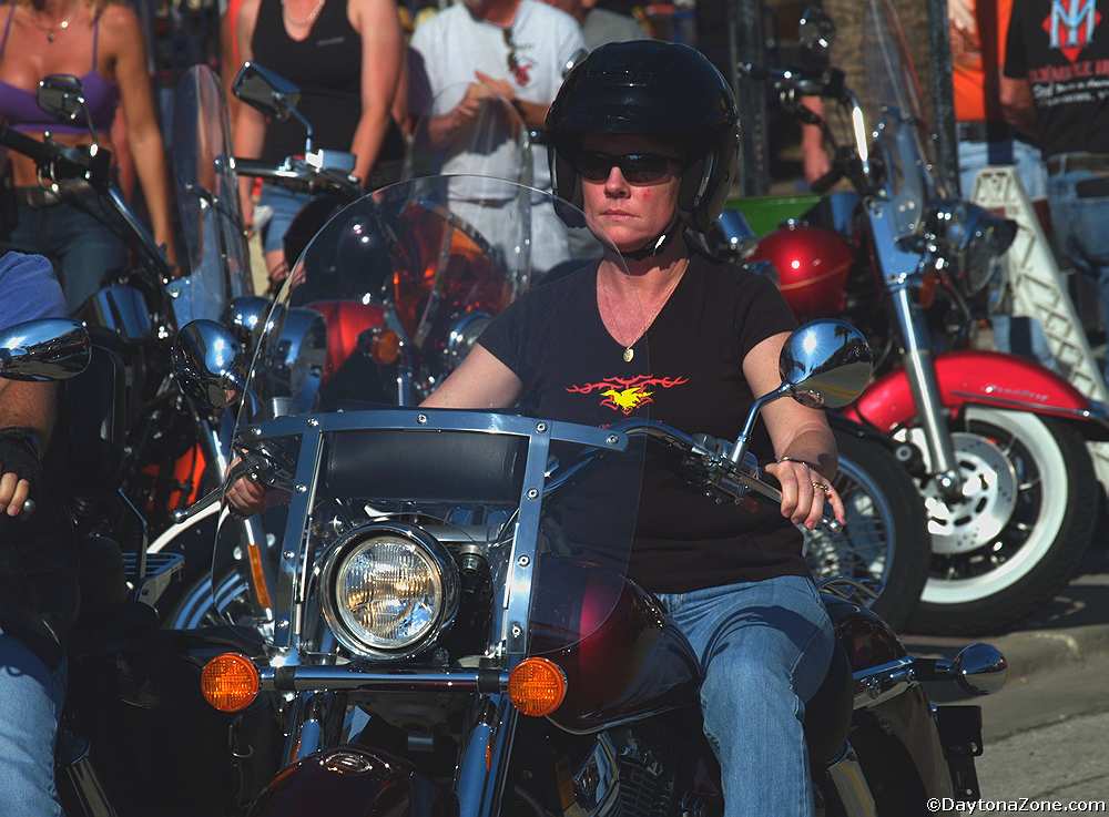 Woman Riding Motorcycle in conservative clothing