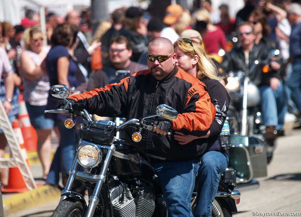 Couple Ride a Harley Davidson