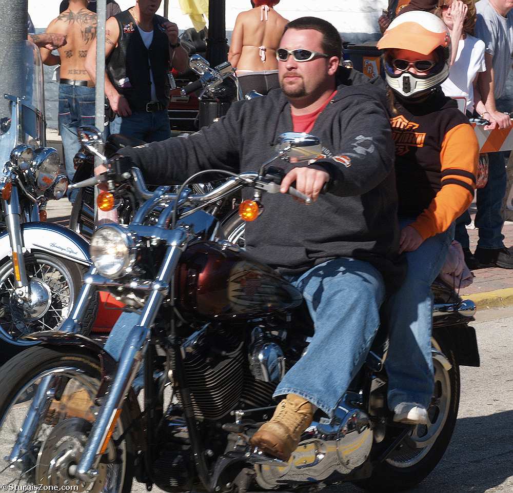 Biker Barehaded, and Another in Helmet